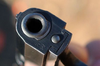 The muzzle end shows how the barrel locks up with the slide. 