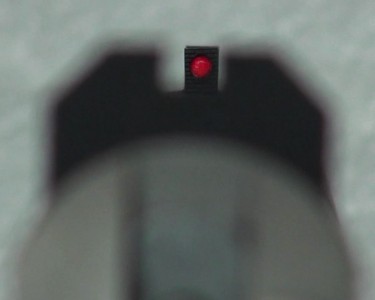 The red glow of the front bead.