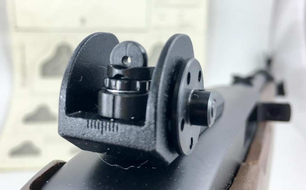 Using an aperture for the rear sight makes things easier on your brain. It naturally centers the front sight post in the middle of the aperture ring.