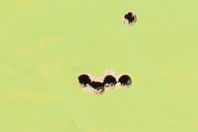 On the first day we were working with the Thompson, I fired this group from the bench--aimed at the top hole, from 100 yards.