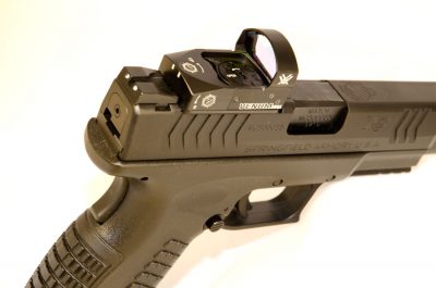 The optic mounting plate sticks out slightly on both sides, but the author still found the slide serrations easier to use on the XDM than on Glock or Smith & Wesson M&P with mounted optics.