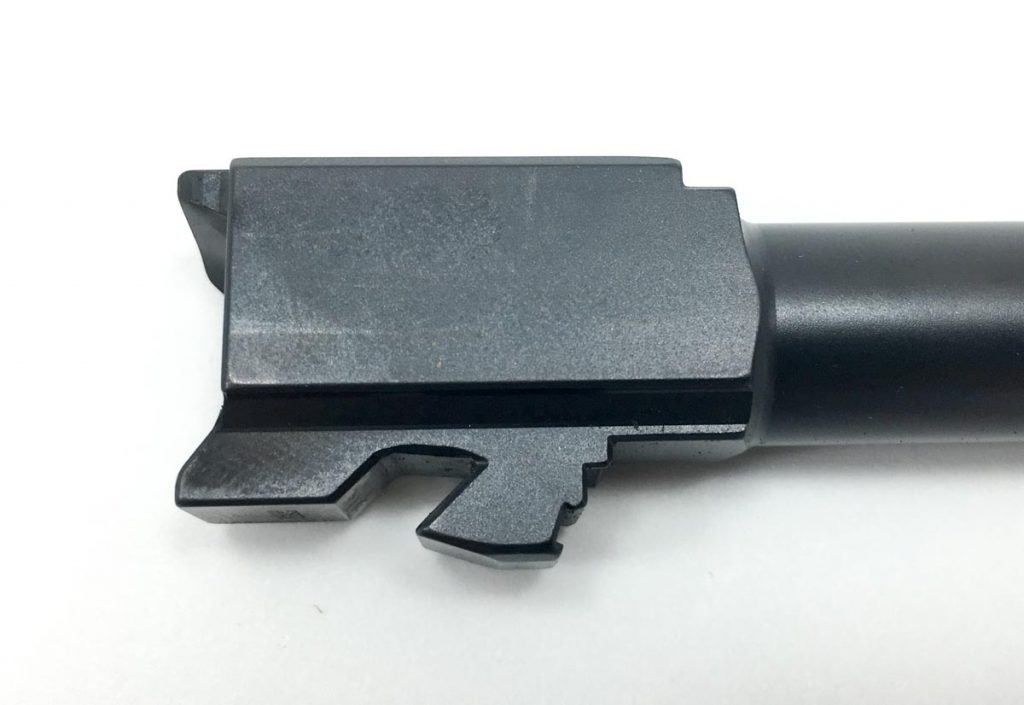The ramped lug on this Glock 19 barrel tilts the barrel down, unlocking it from the slide. 