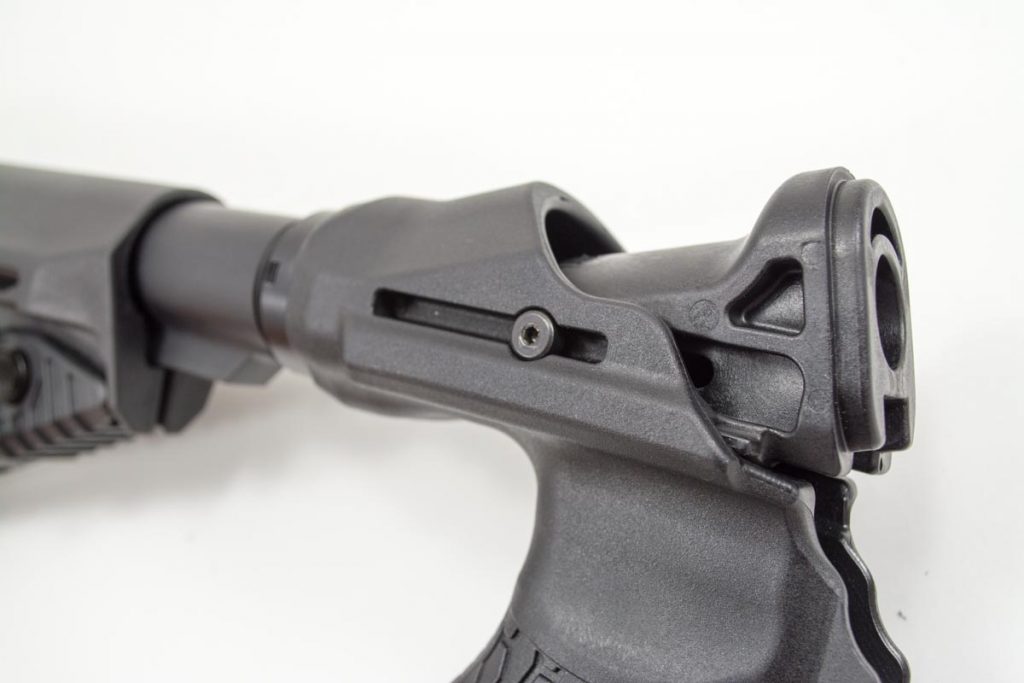 The top slide attaches to the stock on slide rails. The dual springs provide the resistance. 