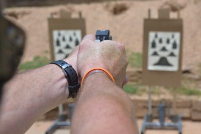 21st Century Derringer! Bond Arms Back Up .45 ACP & 9mm Defender—Full Review Two-handed shooting. Note how the cocked hammer rests in the web of the hand without pinching.
