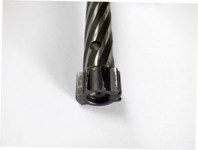 The two piece bolt has two wings on the bottom to pick up rounds from either side of the staggered box magazine.