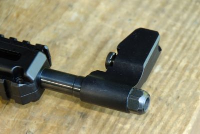 The muzzle of the SUB-2000 is threaded and covered with a barrel nut.