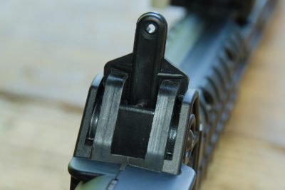 The rear sight is a simple peep aperture unit that sits atop the receiver.