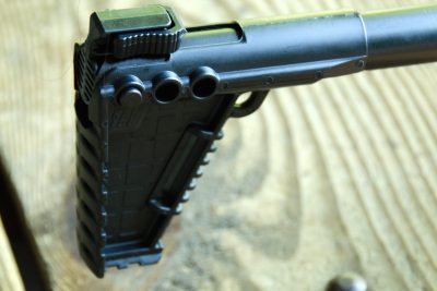 A clip on the top of the buttstock locks the carbine in the folded position.