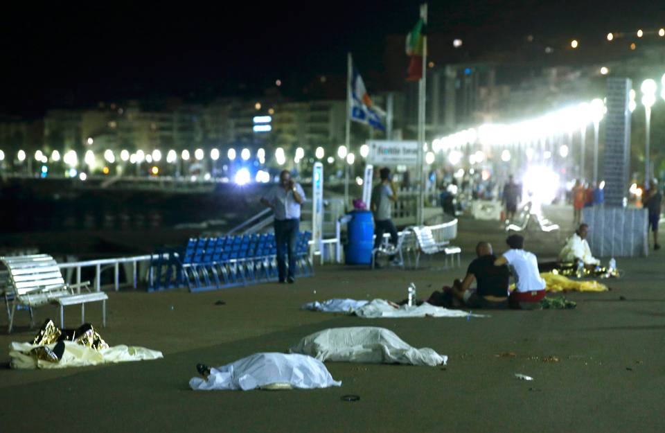 ATTENTION EDITORS - VISUAL COVERAGE OF SCENES OF INJURY OR DEATH - Bodies are seen on the ground July 15, 2016 after at least 30 people were killed in Nice, France, when a truck ran into a crowd celebrating the Bastille Day national holiday, July 14, 2016. REUTERS/Eric Gaillard TEMPLATE OUT.