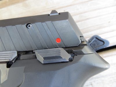 The safety allows users to carry the pistol cocked-and-locked like a 1911 if so desired. Note red dot indicating the safety is disengaged.