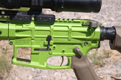 The Grunt utilizes titanium parts as well as extensive lightening cuts to achieve its feathery weight. Note the open-cut mag well.