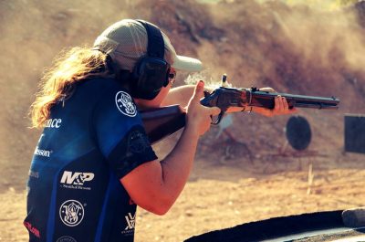 Lena Miculek, shooting a Cowboy Action stage at the 2014 Trijicon World Shooting Championship. 