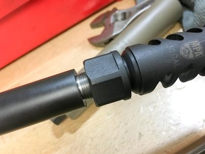 The muzzle brake uses a counter-rotating lock nut to time the proper direction of the baffles.