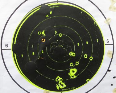 The author kept his shots on this 8-inch target at 25 yards while firing "bursts" three, four and five shots.