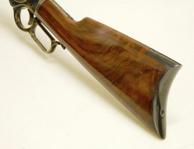 Note the attractive grain of the walnut buttstock and the curved steel buttplate. 