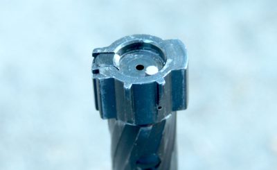 Instead of using a steel flap like on the 5.56 bolt, the 7.62 has lugs on the bottom of the bolt that act in a similar way as the lugs on a 7.62mm AR bolt. 