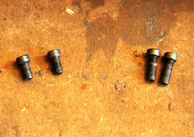 Make sure you keep base screws organized so that you know which screw goes where. If you inadvertently put one of the long screws in the front you could prevent the bolt from working properly.