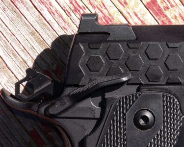 A safety for southpaws, and a rear sight for one-hand racking.