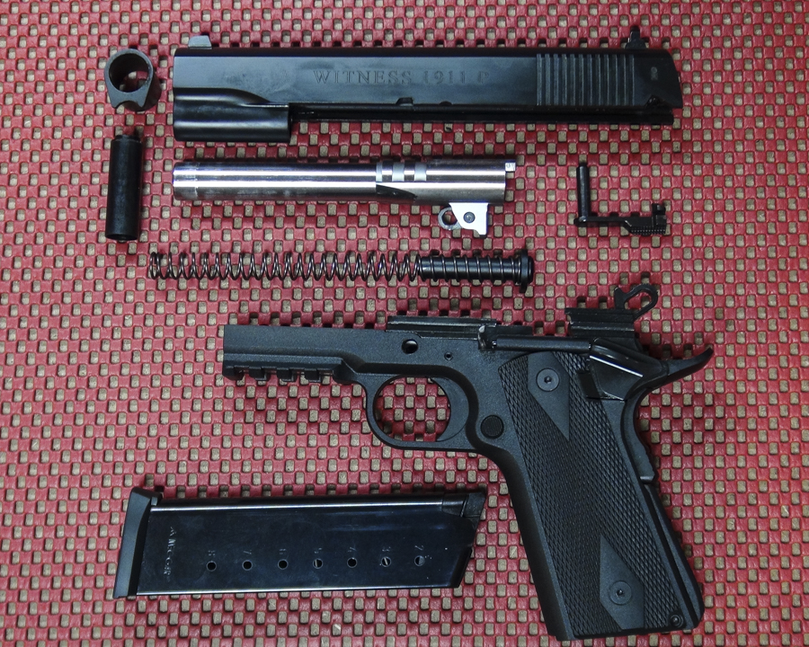 The basic design is GI, with a few 'extras' such as a tac rail, lightened hammer, and enhanced grip safety. The guide rod and plug are also polymer.