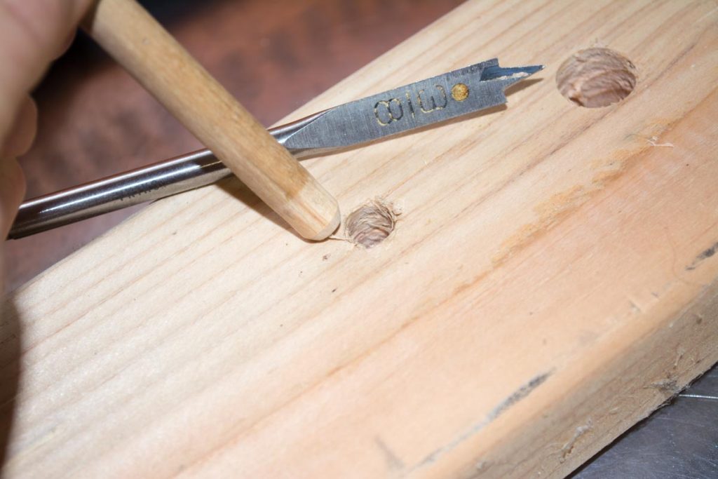 If we want to "seat" this wooden dowel so that it doesn't move in or out, drilling a slightly smaller hole will do the trick.