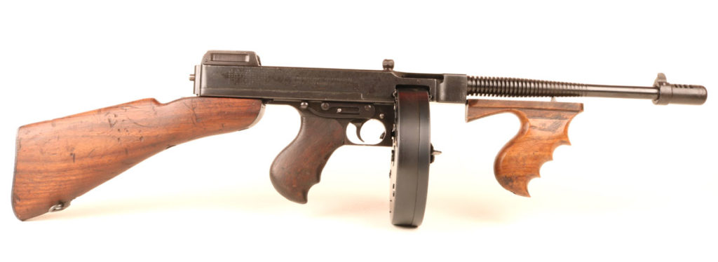 Early M1921 and M1928 Thompson submachine guns with heavy drum magazines
