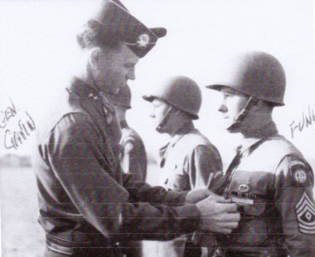 Leonard Funk decorated by General James Gavin after extraordinary airborne combat service