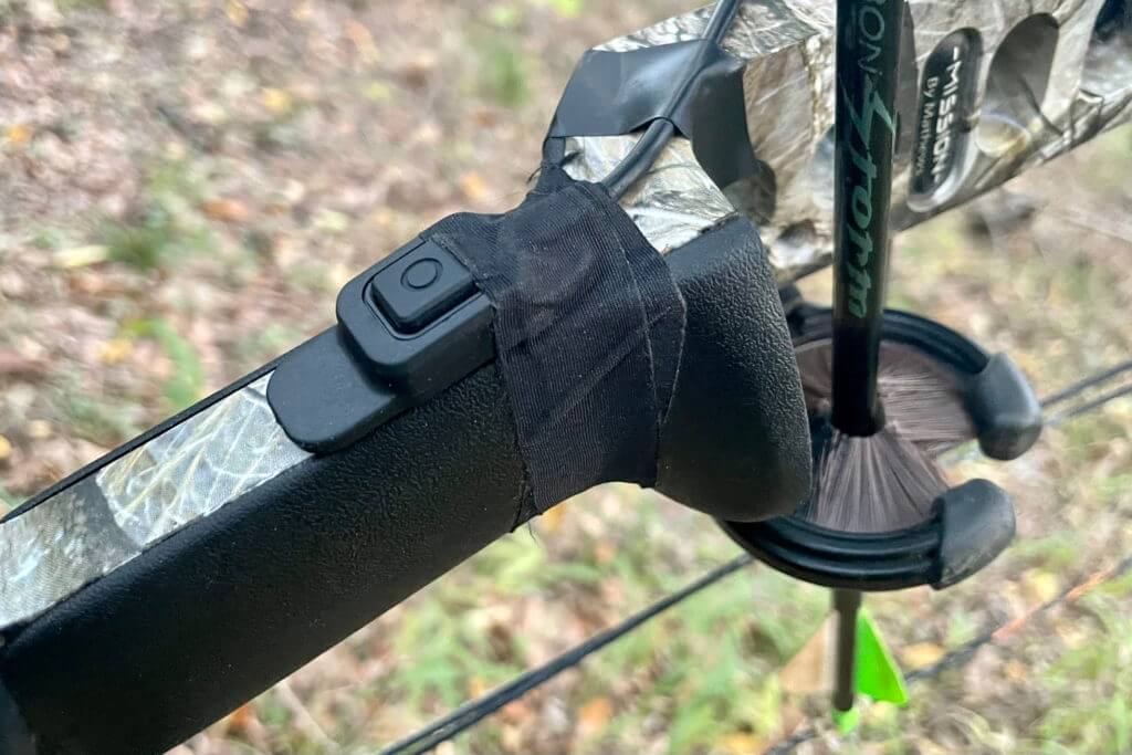 Garmin Xero® A1i PRO Bow Sight showing the push button for ranging. 