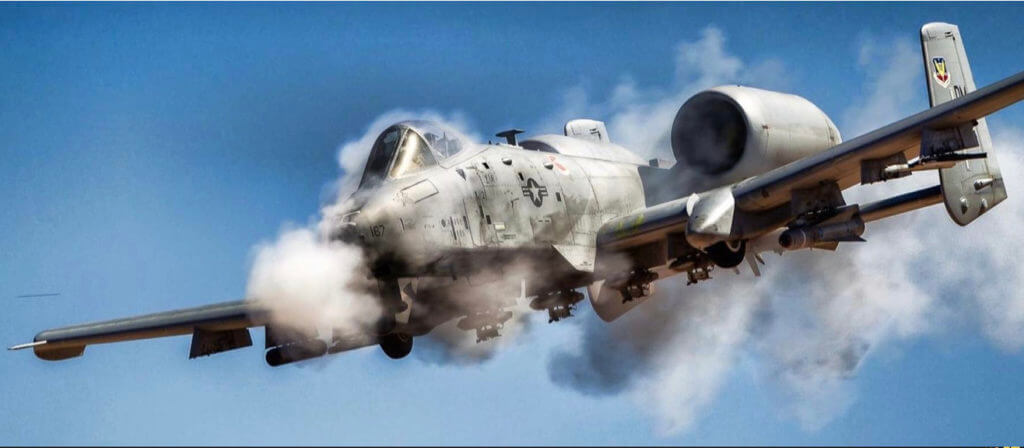 A-10 Warthog bursting through clouds