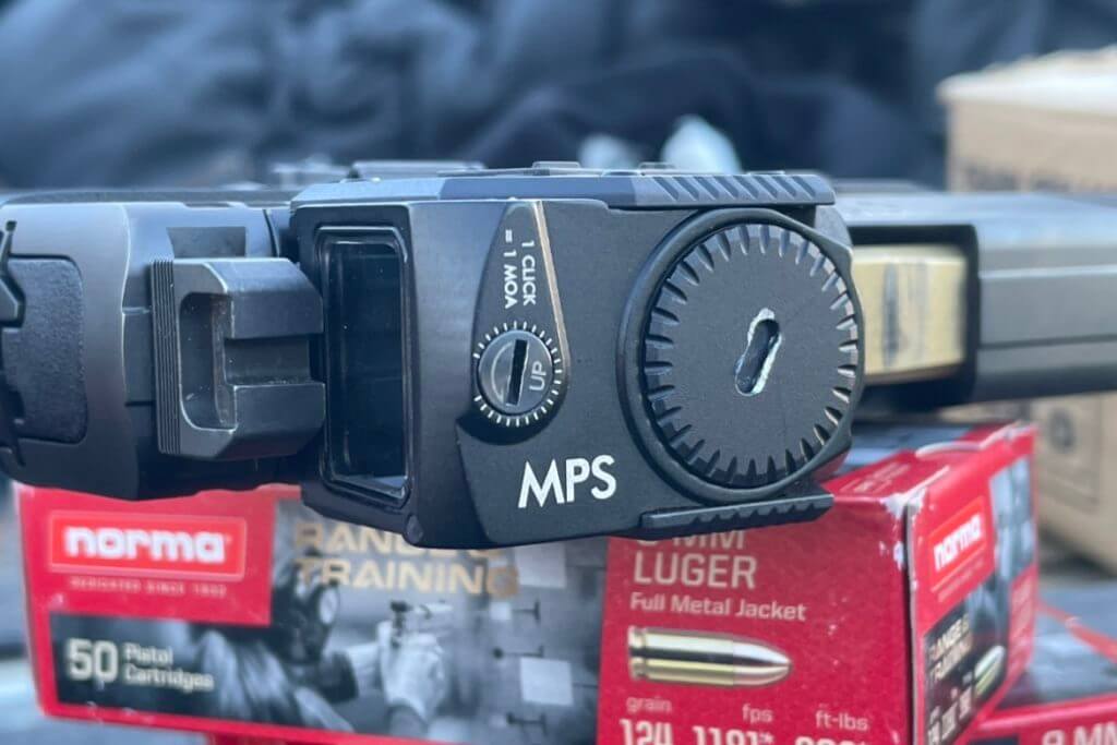 Steiner MPS mounted on pistol sitting on a box of Norma ammunition