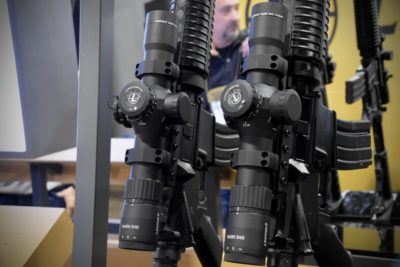 Rifle scopes mounted on AR15 rifles.