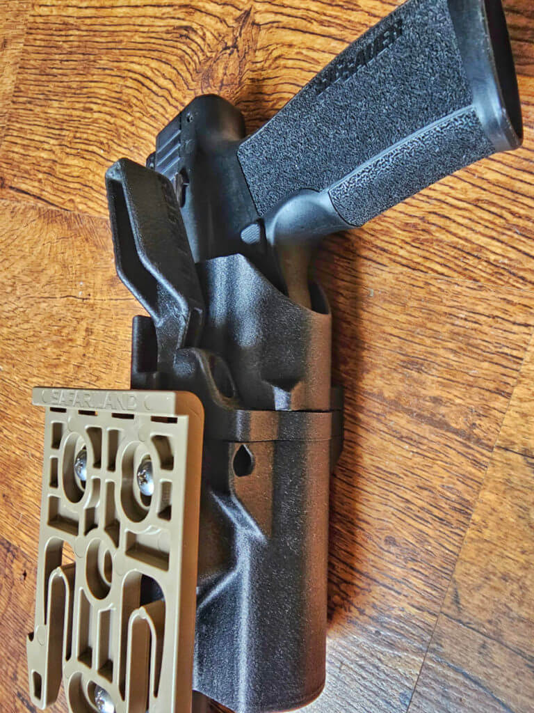 Hush Holsters Thumb Drive Retention Holster showing Safariland Mount and Thumb release. 