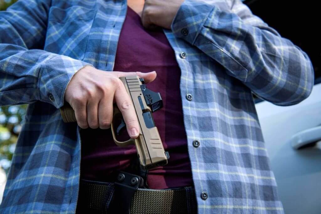 The FN Reflex being drawn from a holster.