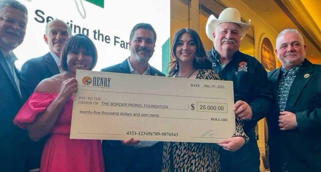 Henry Repeating Arms sends $25K check to the Border Patrol Foundation.