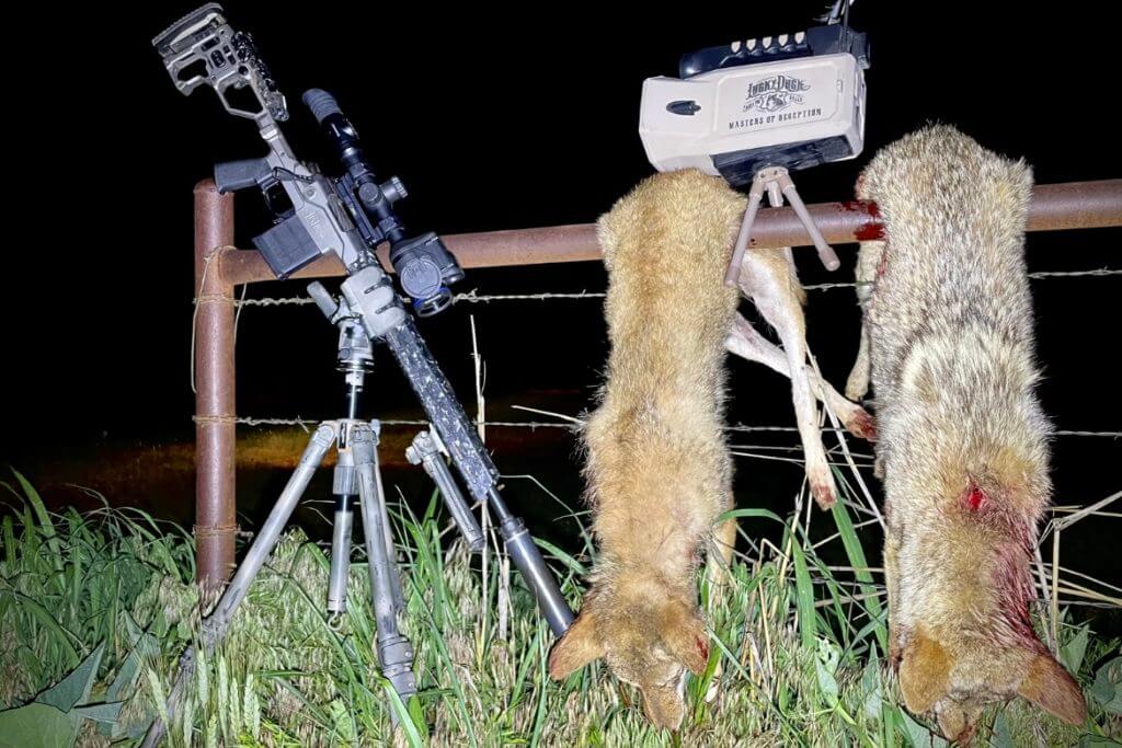 2 - Review: Christensen Arms MPR Put to the Test Christensen Arms MPR topped with a Pulsar Thermion 2 LRF XP50 Pro sitting in a Kopfjager K800 tripod next to a Lucky Duck Super Revolt call that was used to lure in two coyotes