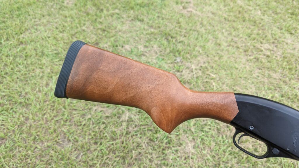 Winchester 1300 Defender series buttstock outside in front of green grass