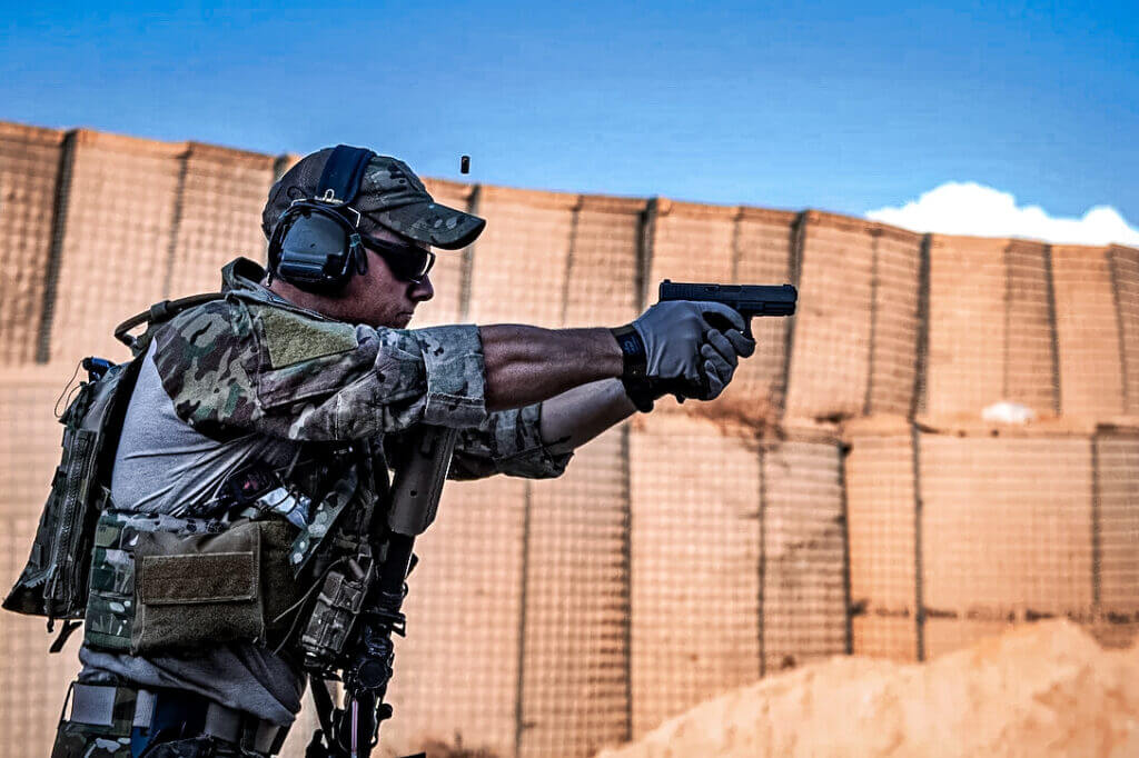 U.S Airforce man shooting pistol