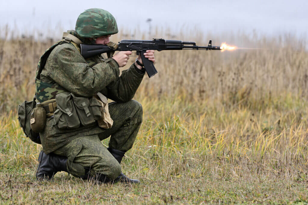 man shooting gun. Russian