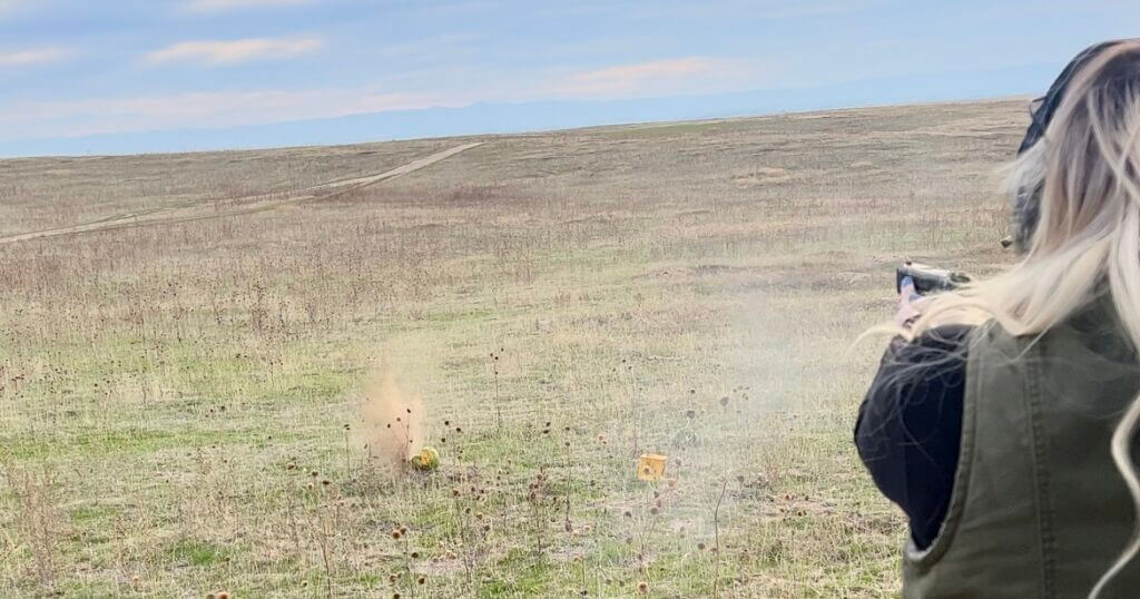 shooting the Beretta APX A1 Compact at watermelons