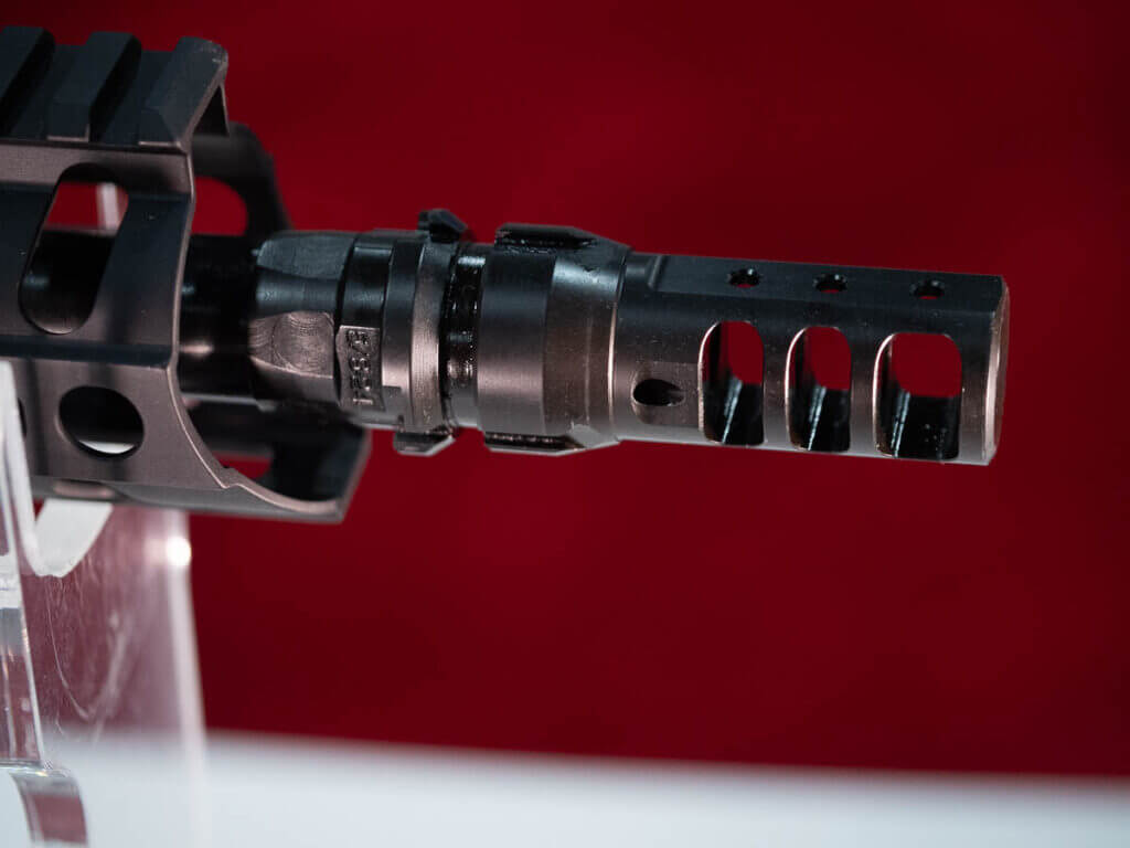 Close up of the end of the barrel with the brake welded in place. The gun is facing right.