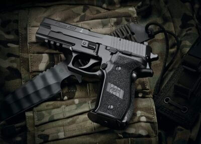 A SIG P226 pistol on a backpack.