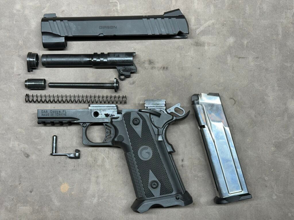 The Girsan Witness2311 is disassembled on a cleaning mat.