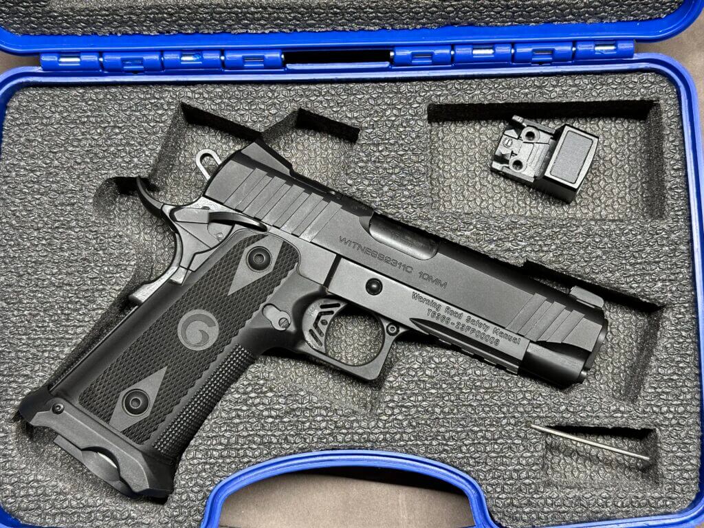 The Girsan Witness2311 C 10mm is in a blue hard-case with foam cutouts.
