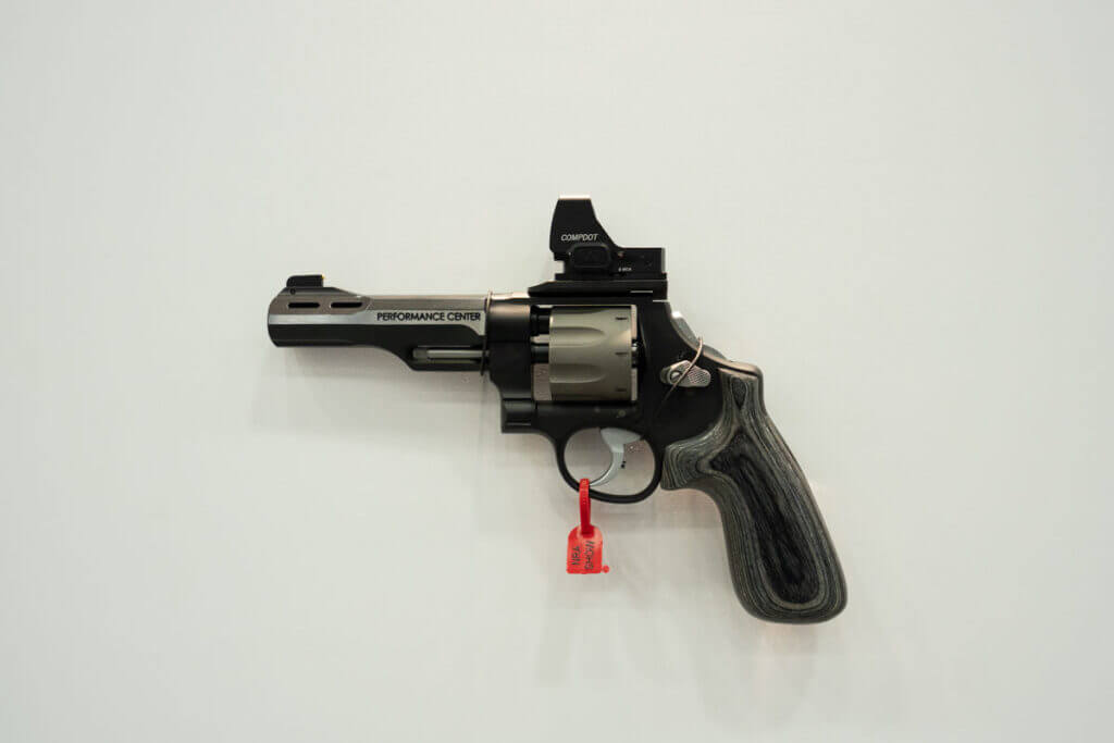 A Model 327 WR revolver on the wall.