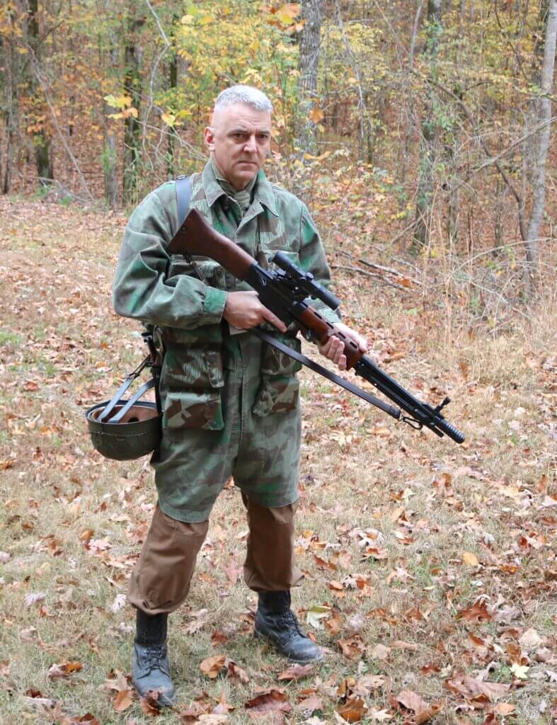 Man in camo holding FG42