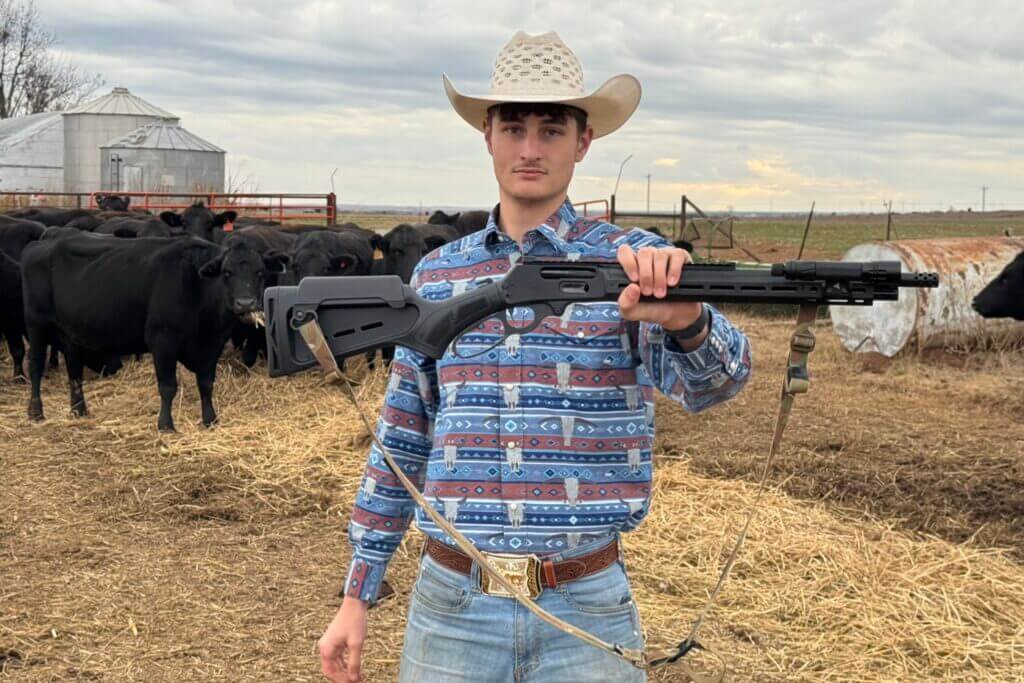 Cowboy holding the Marlin Dark Series Model 1895