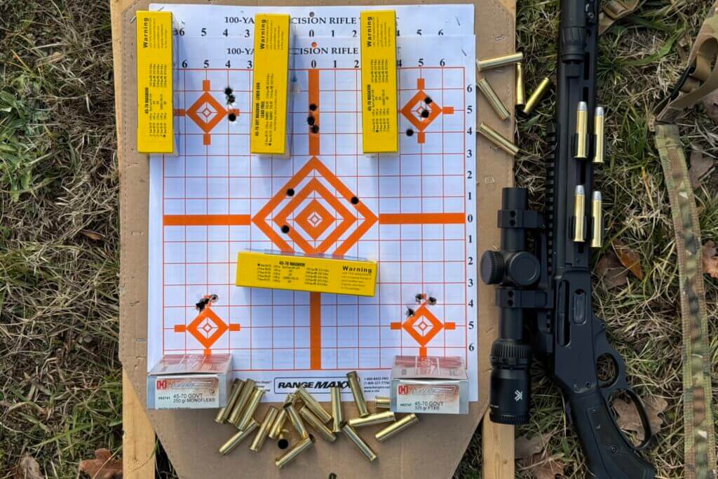 Marlin Model 1895 next to target and boxes of ammo