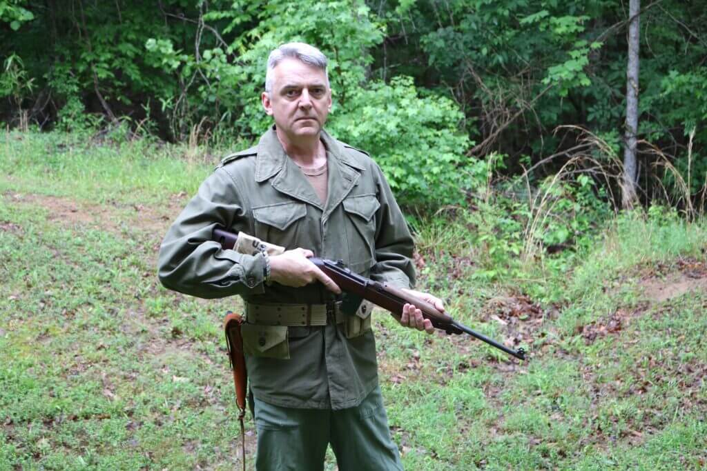 White-haired soldier holding M1 Carbine