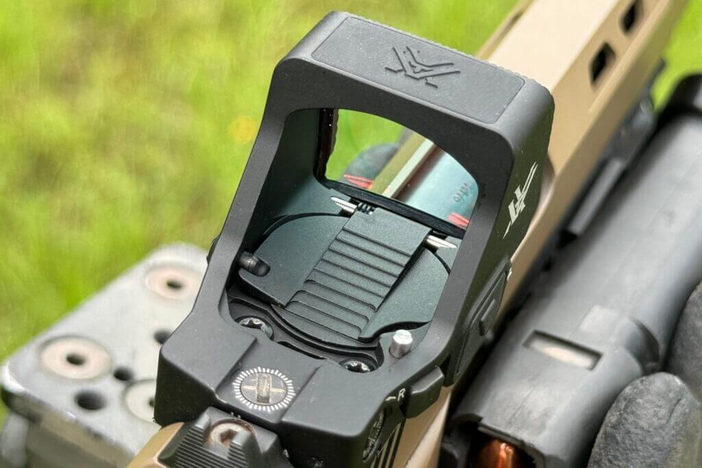 The Vortex Defender-XL mounted on a beige handgun