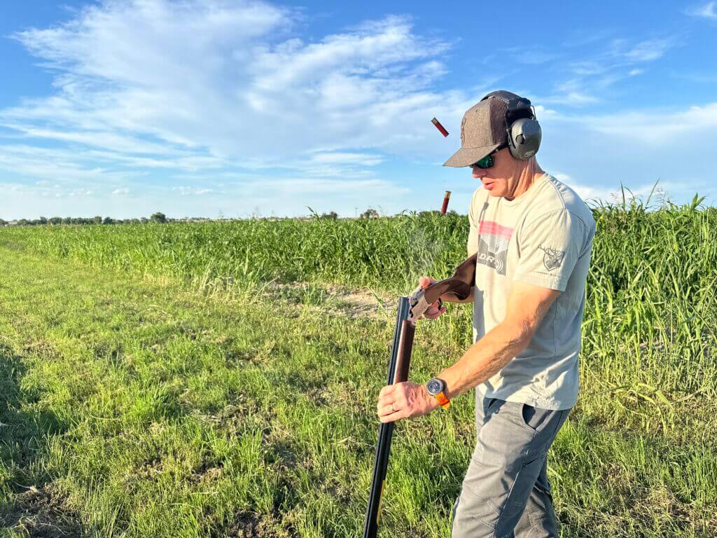 man shooting Citori 725