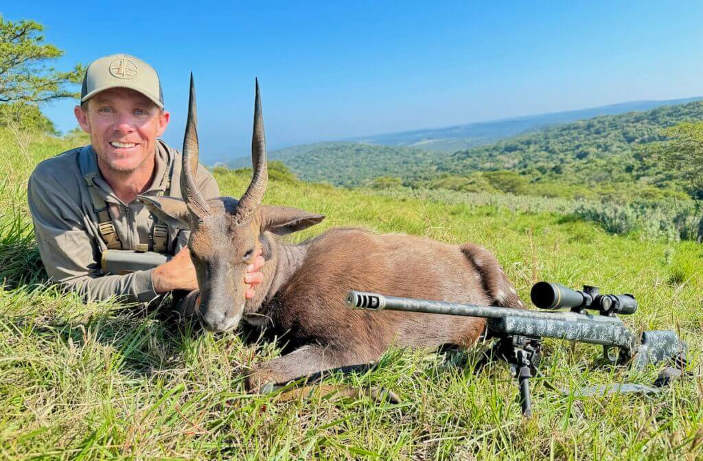 Hunter with Cape bushbuck from Africa